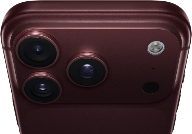 iPhone 18 Pro Max borgogna (rosso scuro) mostrato da dietro, sistema di fotocamere Pro Fusion nella parte superiore, 3 obiettivi, diaframma ad apertura variabile parzialmente chiuso, flash, microfono e scanner LiDAR, mostrati dall’alto, antenna cellulare, lati piatti, bordi arrotondati